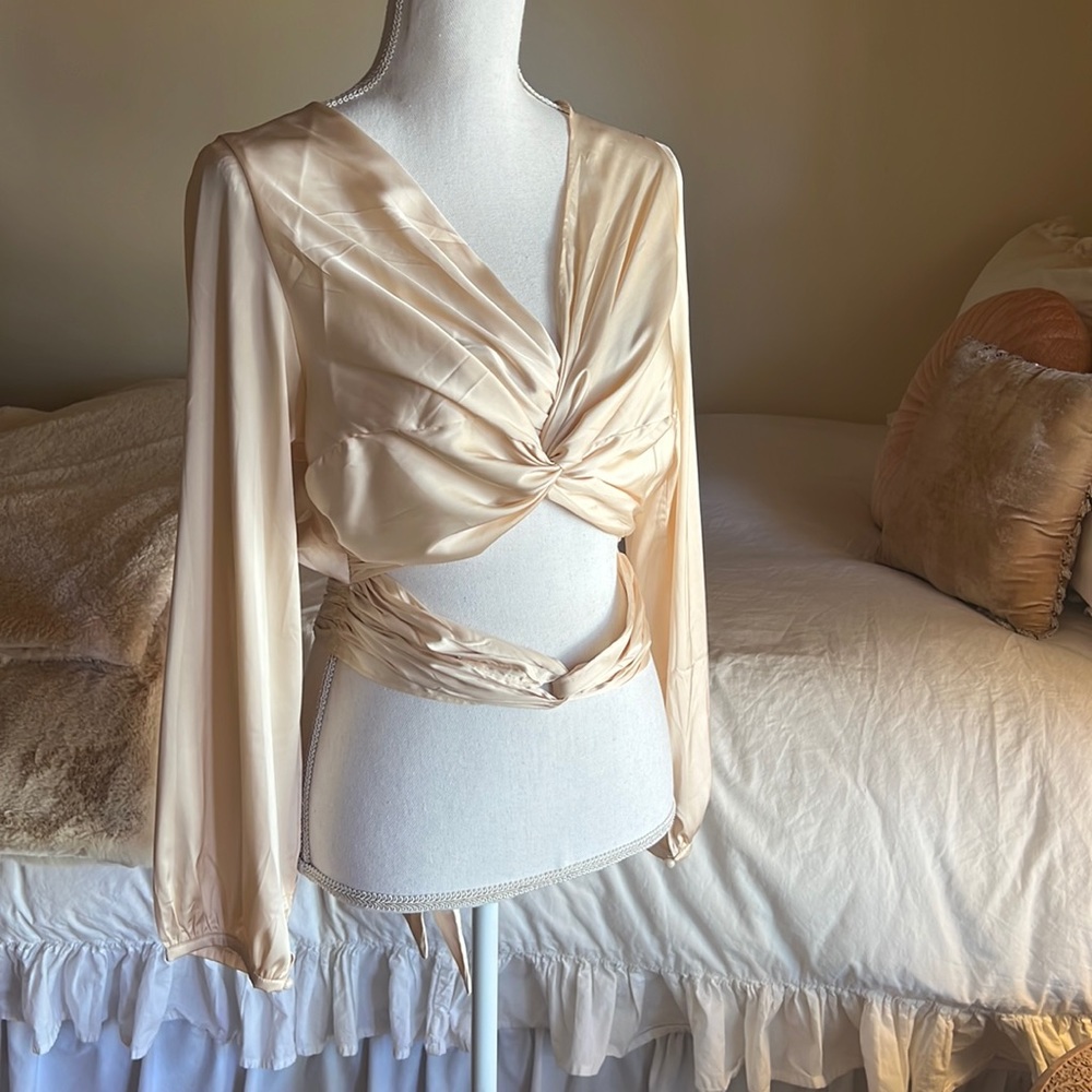 Beautiful cream wrap tie blouse. Size L